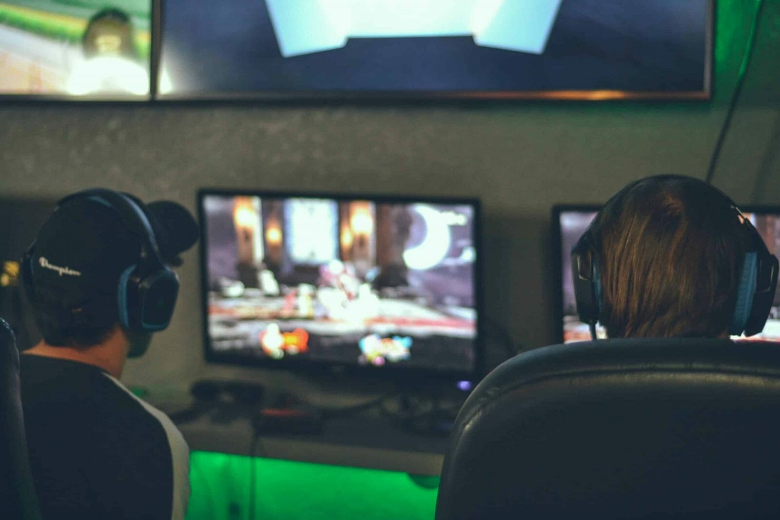 Image of two people gaming.